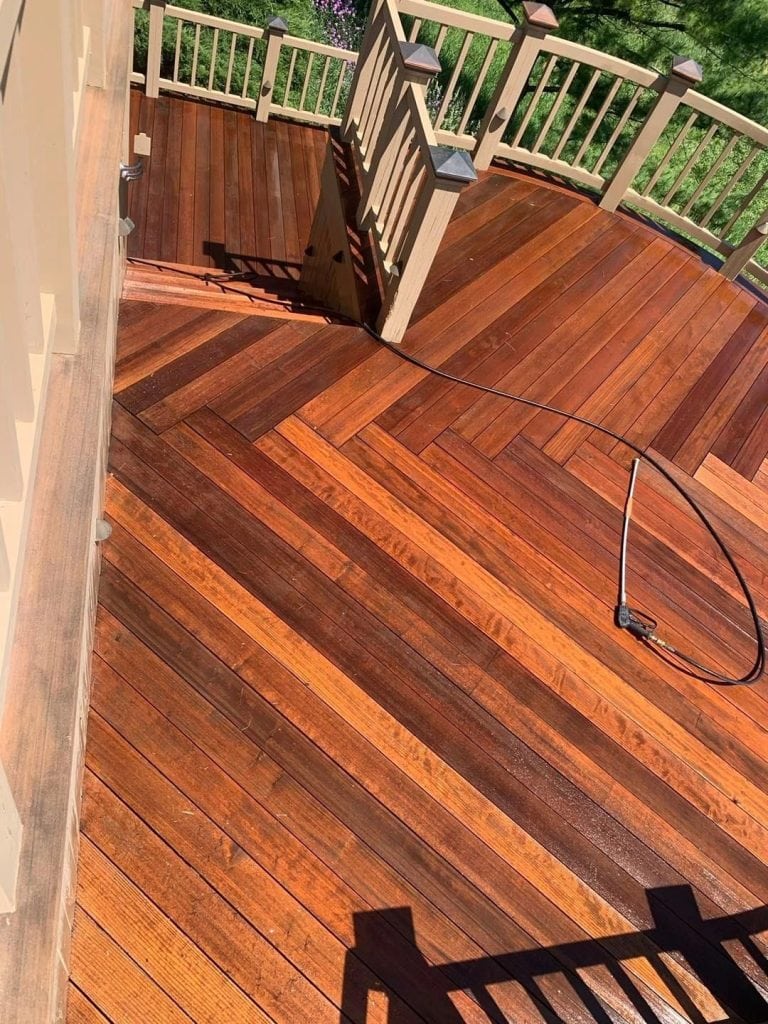 High-quality wood deck refinishing showcasing rich, vibrant stain and protective coating.